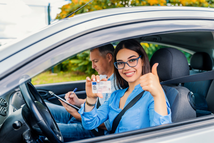 driving-school-beautiful-young-woman-successfully-passed-driving-school-test-she-looking
